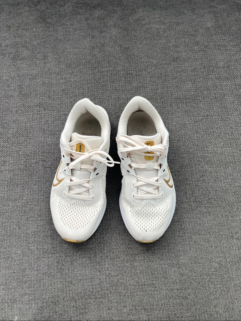 Nike Women’s White Athletic Shoes with Gold Swoosh